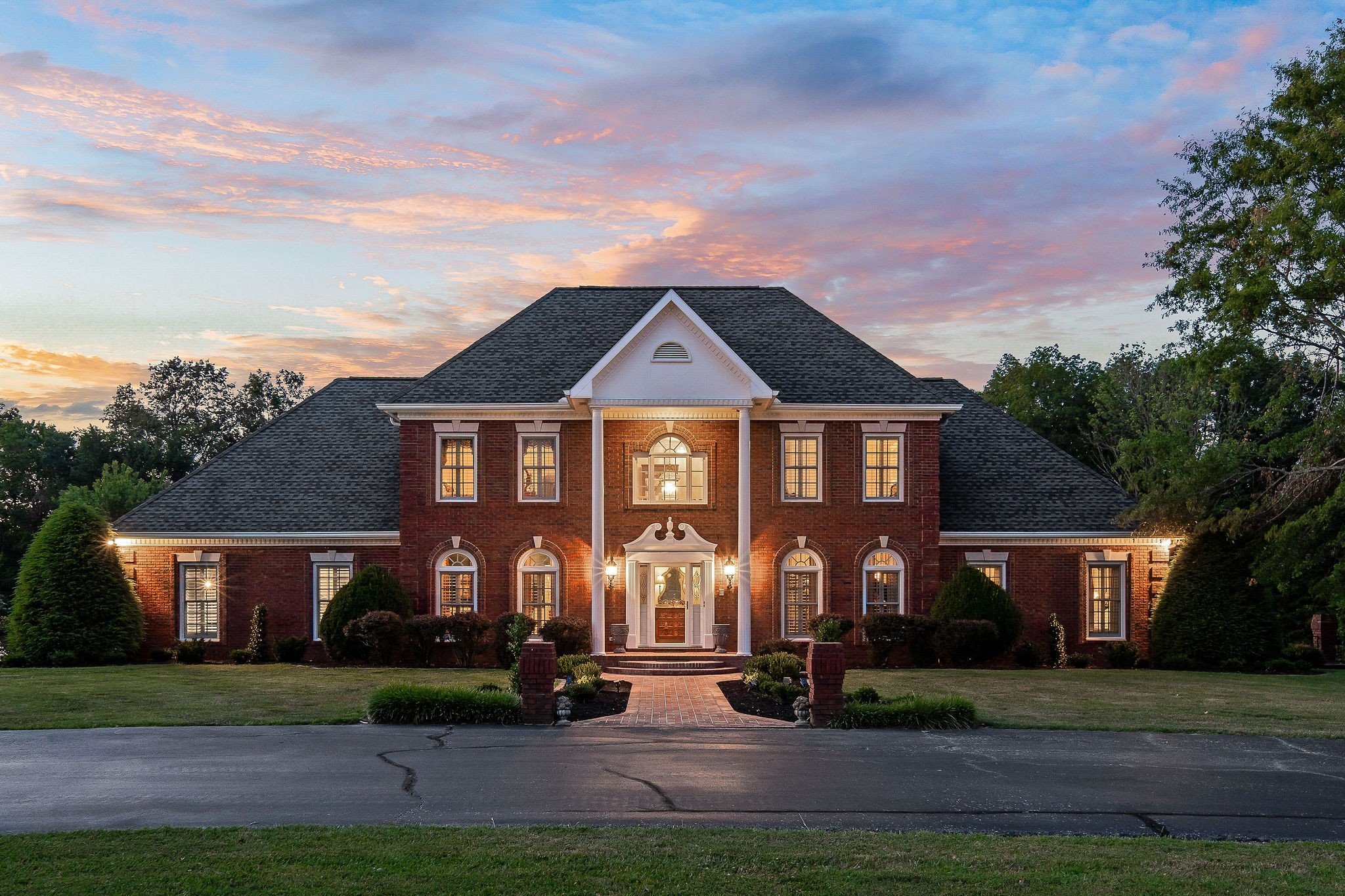 a front view of a house with a yard