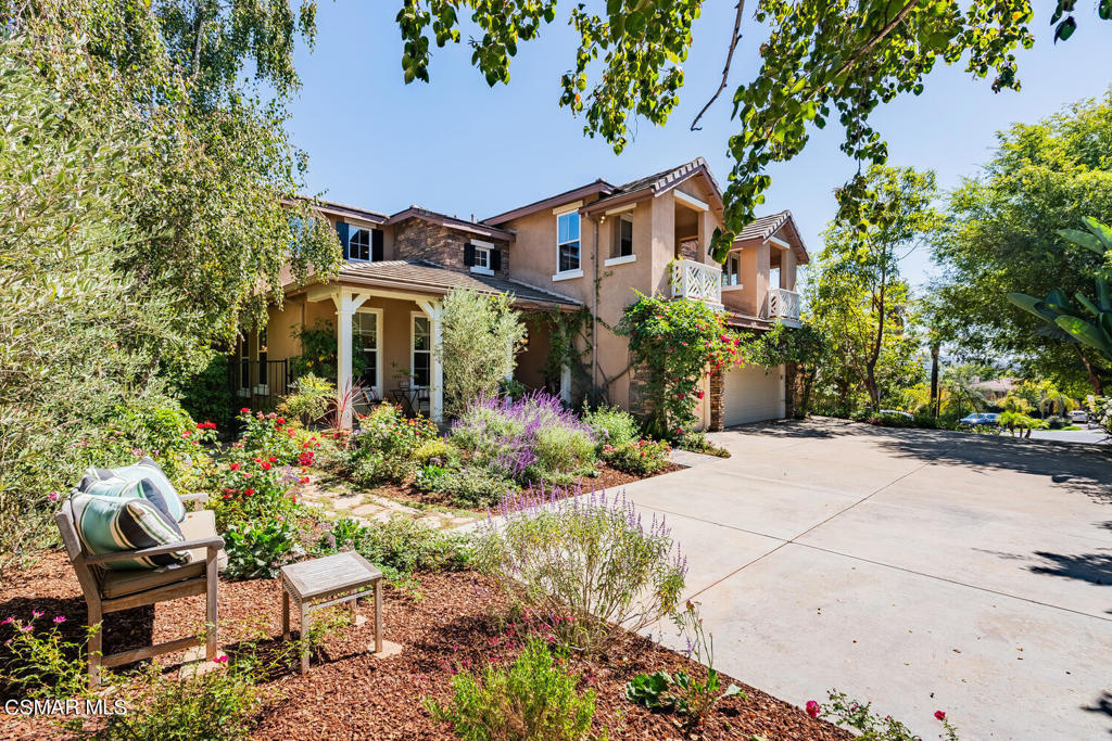 front view of a house with a garden