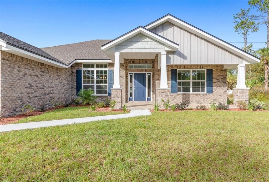 front view of a house with a yard