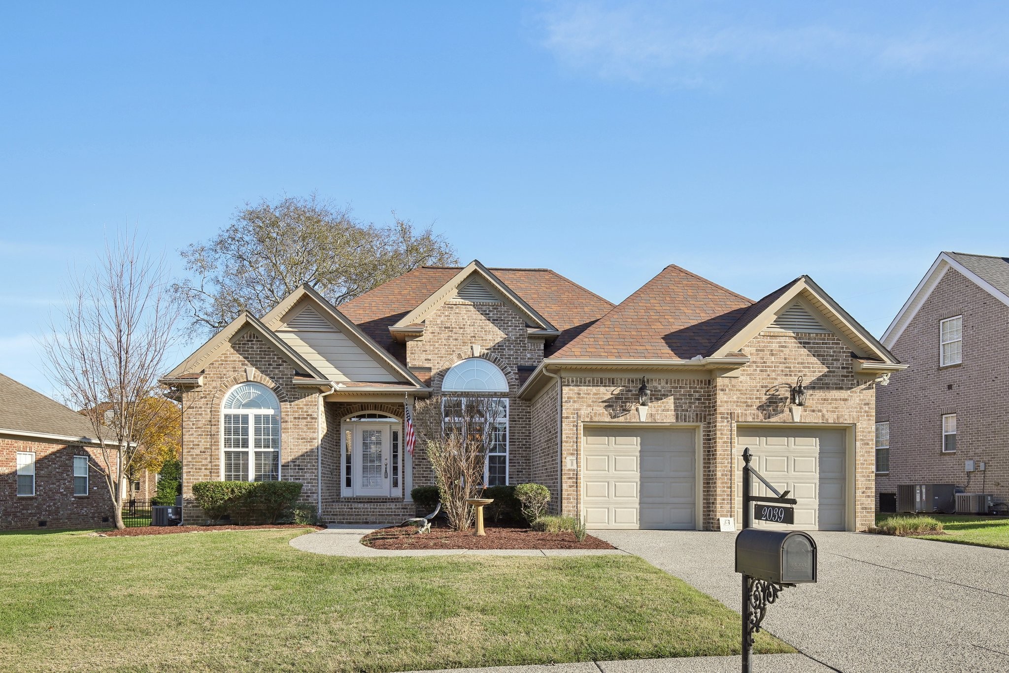 a front view of a house with a yard