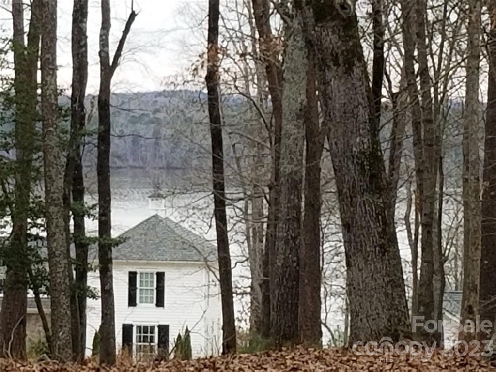 a front view of a house with trees