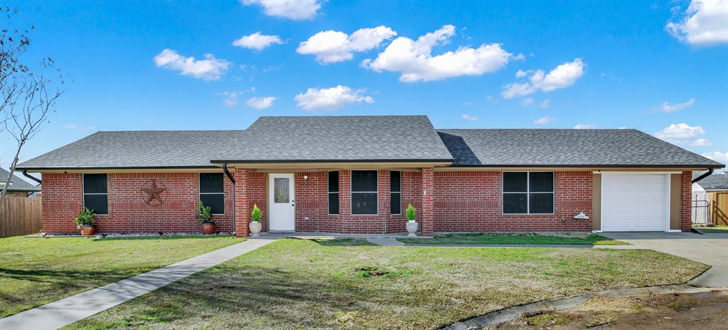 front view of a house with a yard