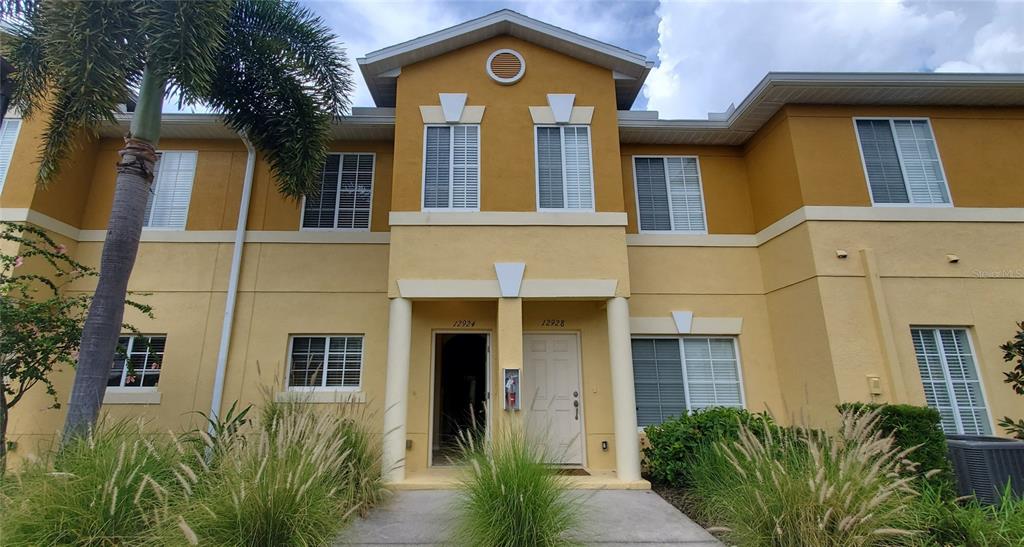 a front view of a house having yard