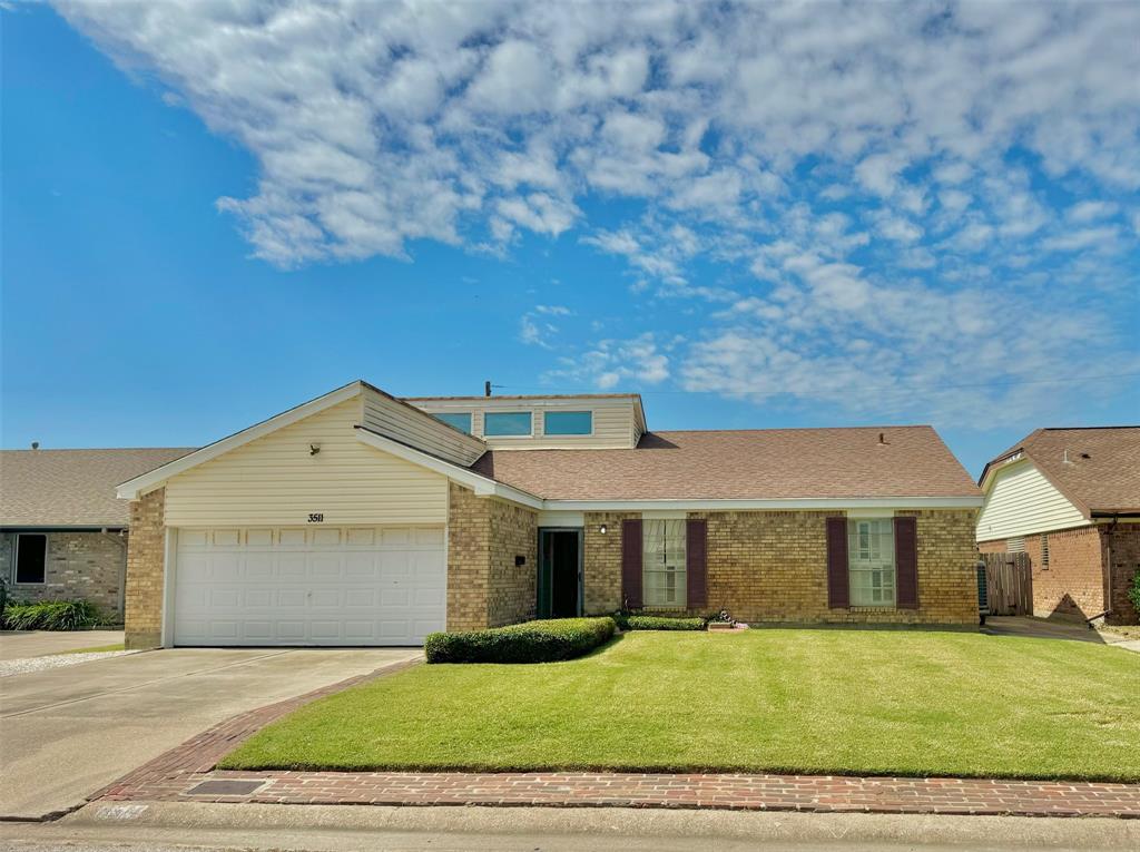 a front view of a house with yard