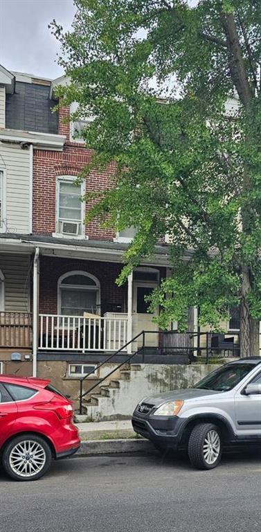 a car parked in front of a house