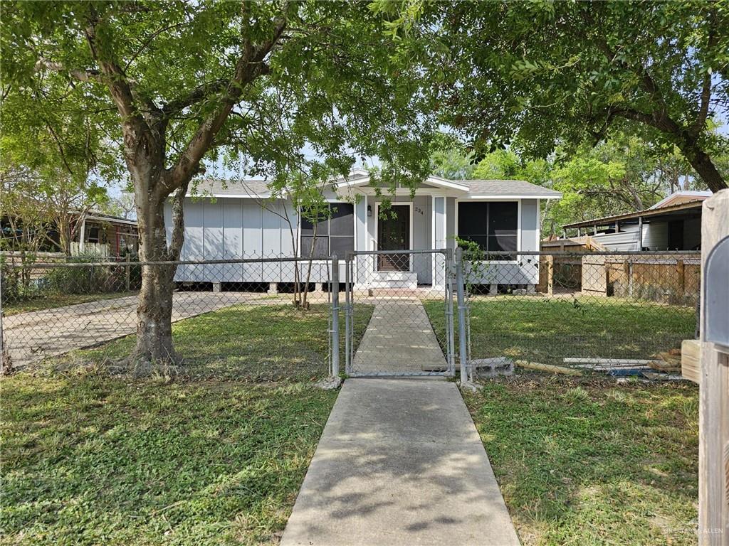 a front view of a house with yard