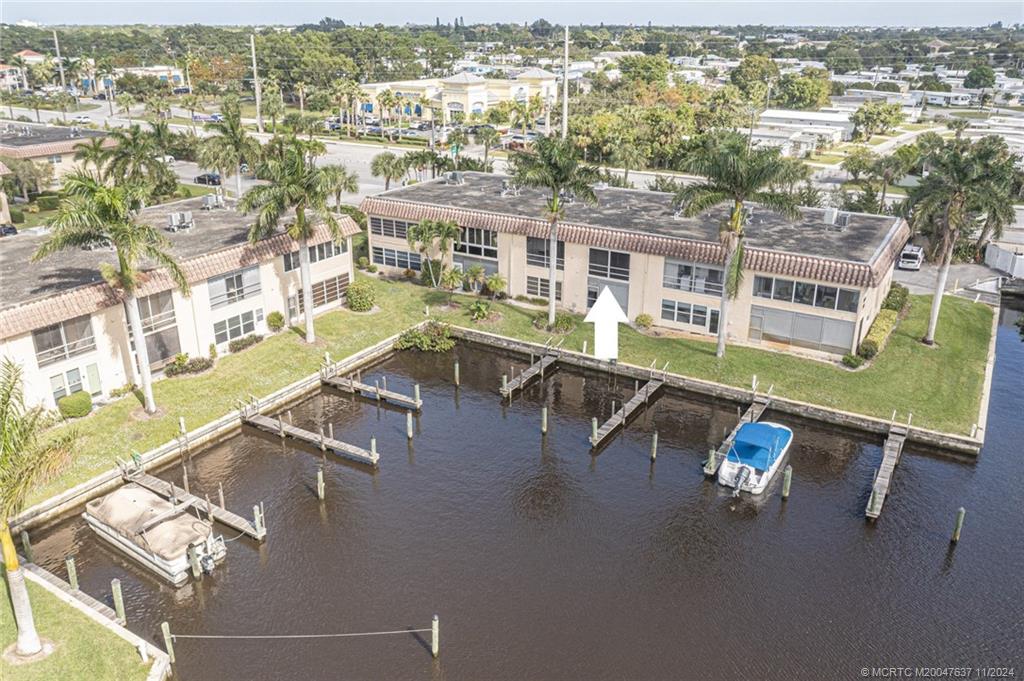 an aerial view of residential house with outdoor space and swimming pool