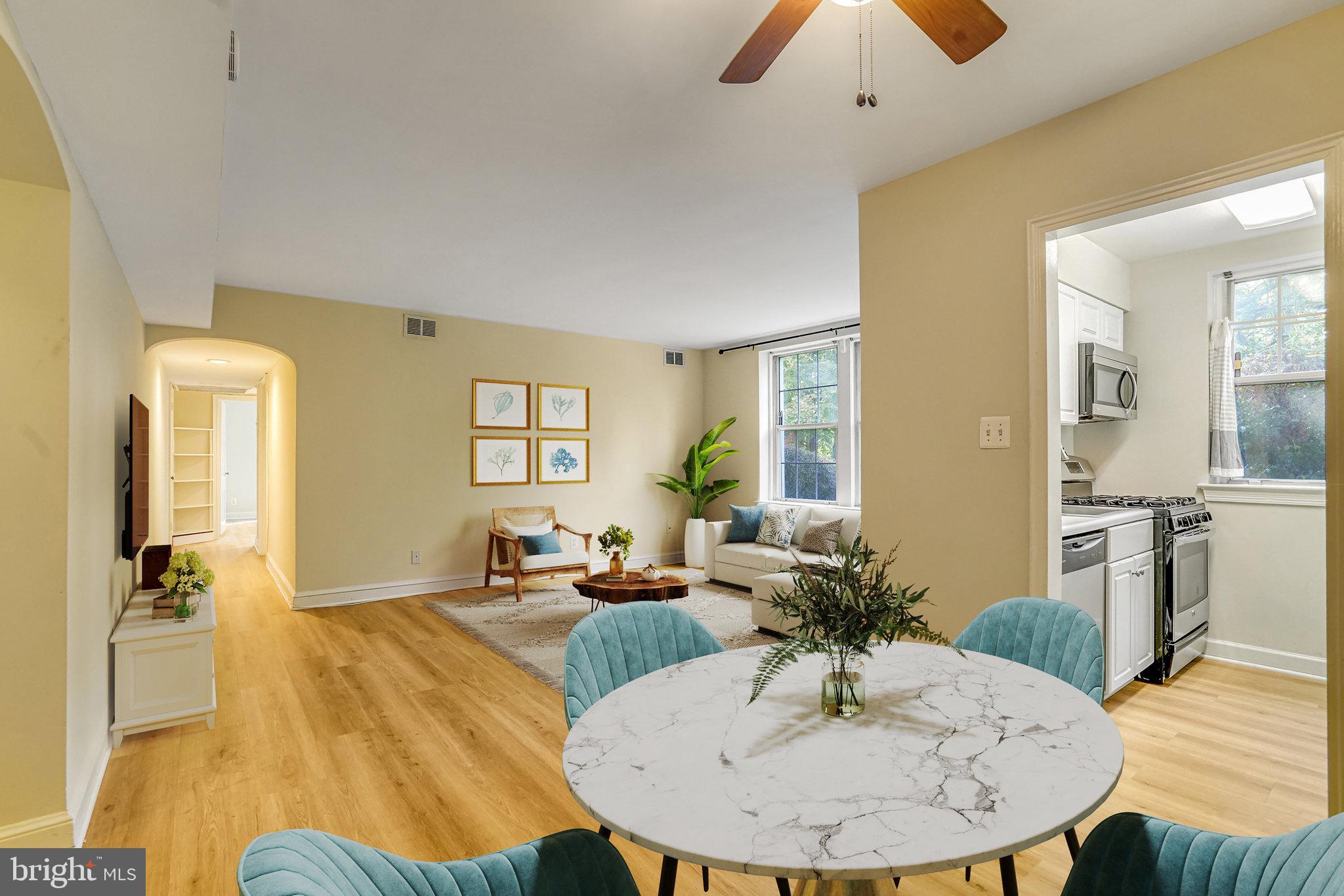 a view of a dining room with furniture and wooden floor