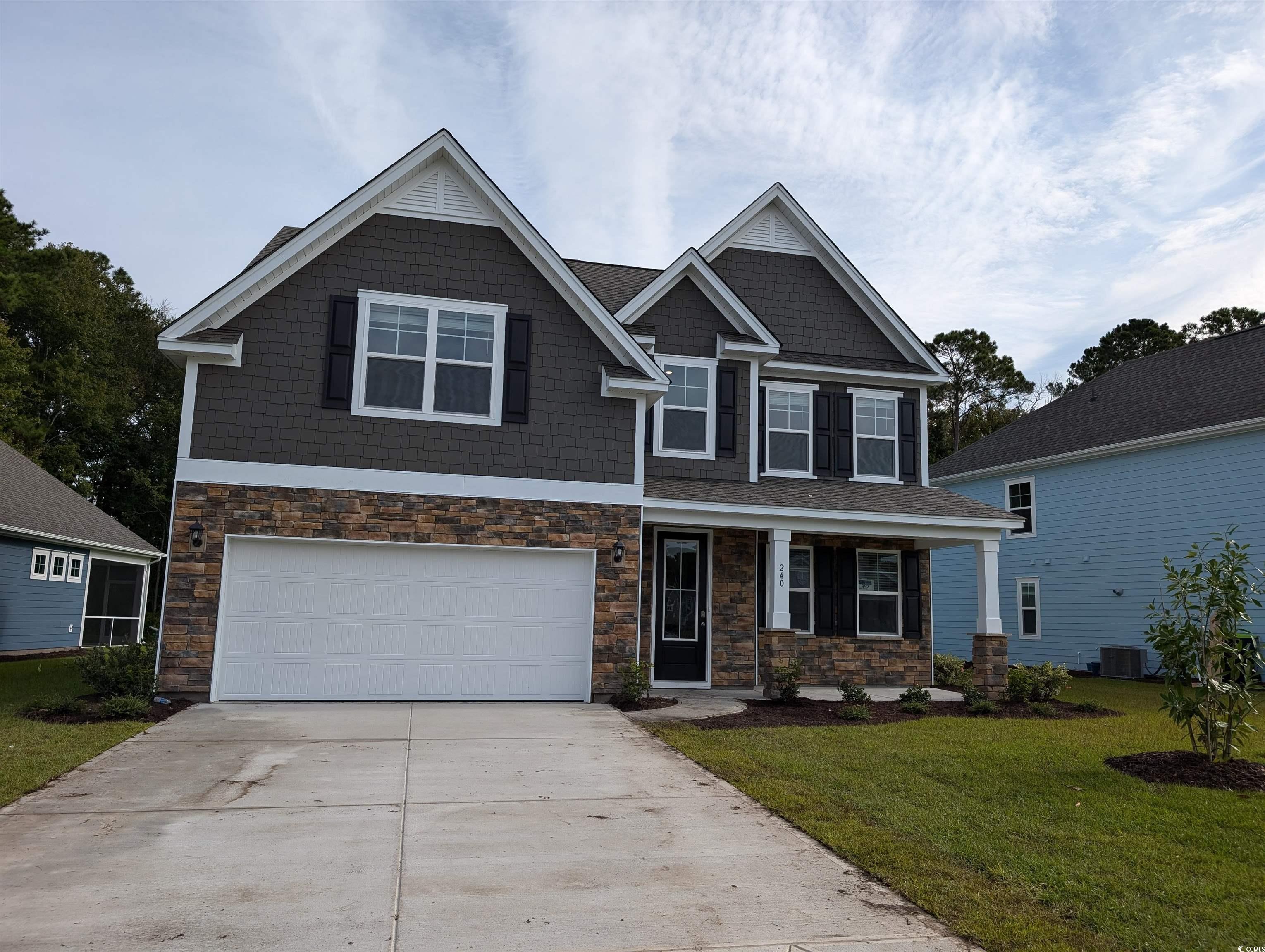 Craftsman-style home featuring central air conditi