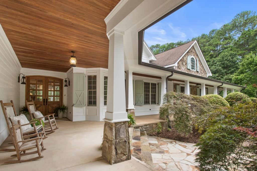 a front view of a house with outdoor seating