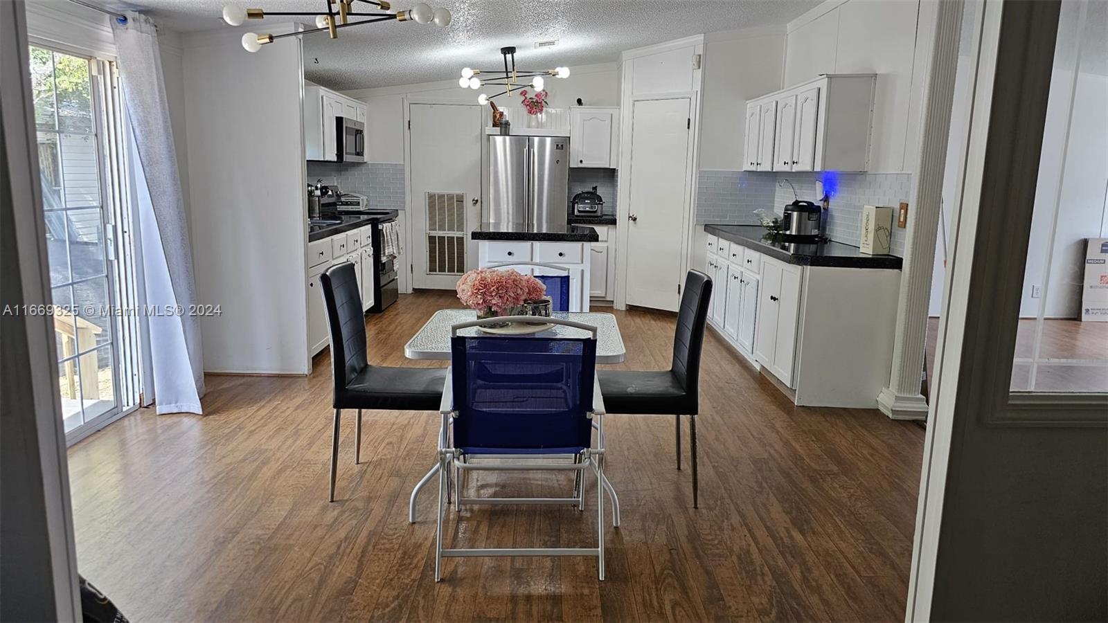 a dining room with furniture and wooden floor