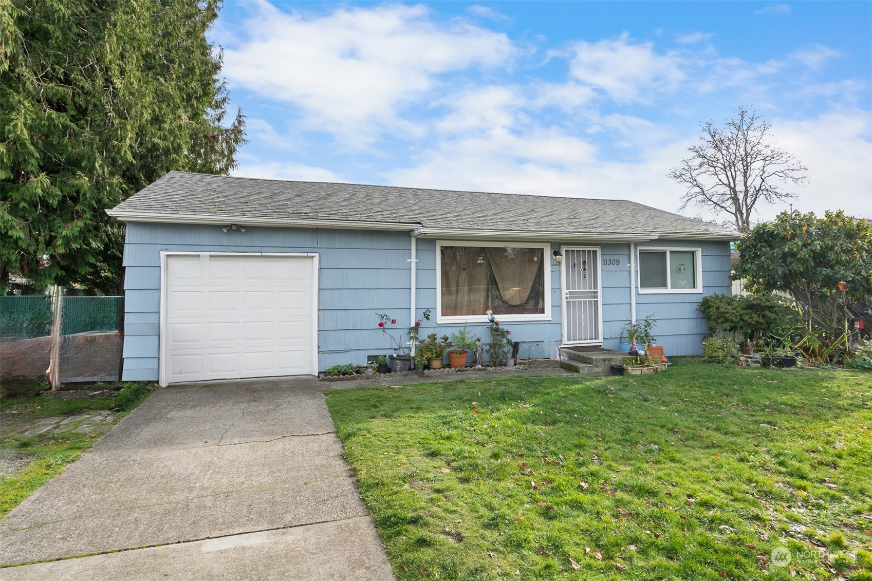 a front view of house with yard and green space