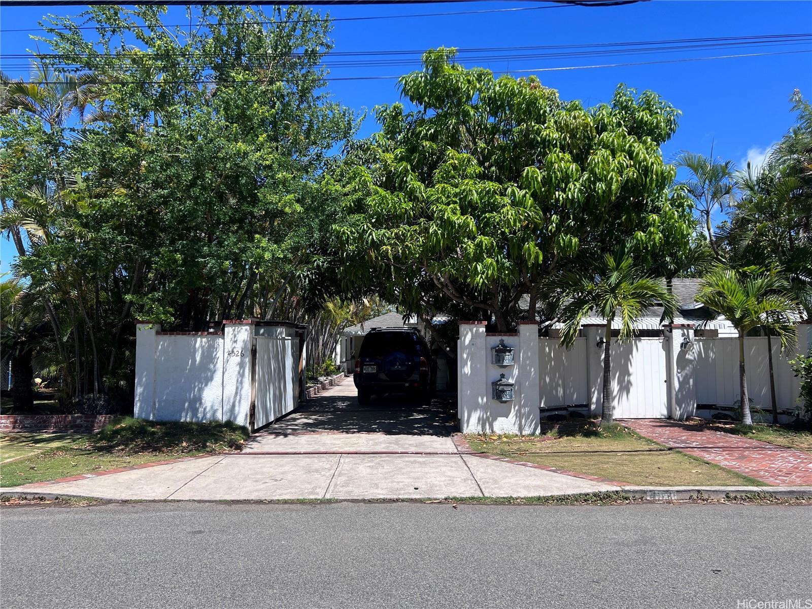 a view of a house with a street