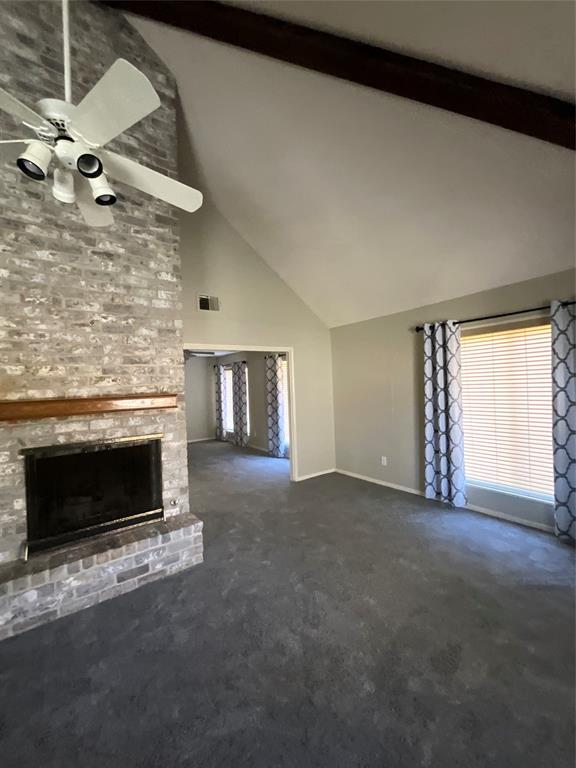 a view of empty room with a fireplace