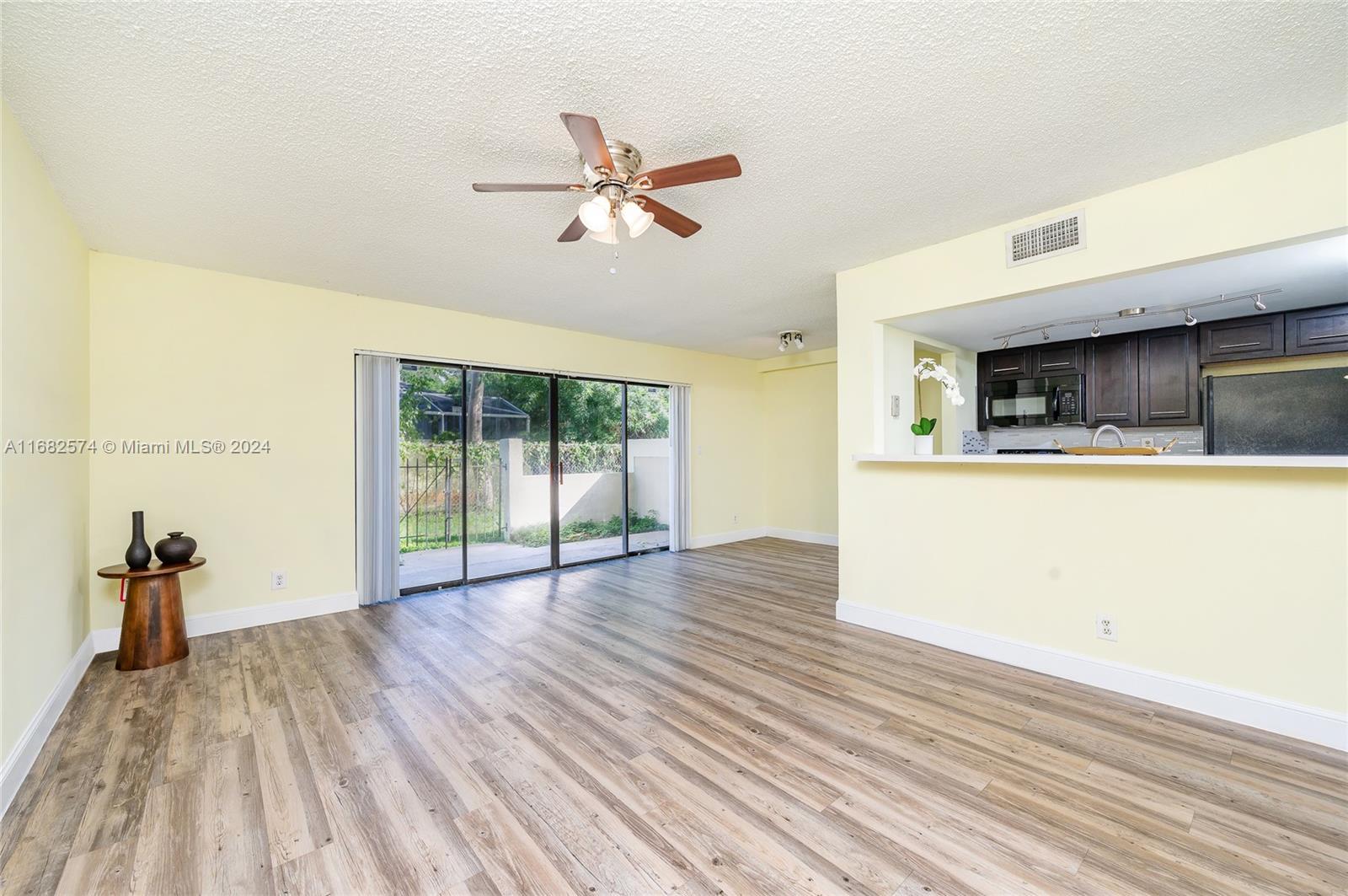 a view of a living room with a flat screen tv