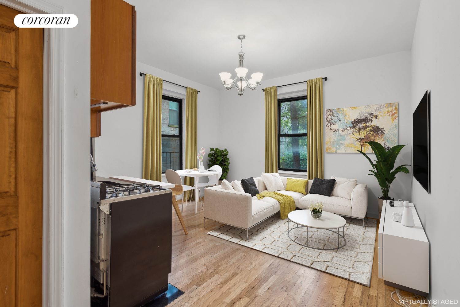 a living room with furniture and a chandelier