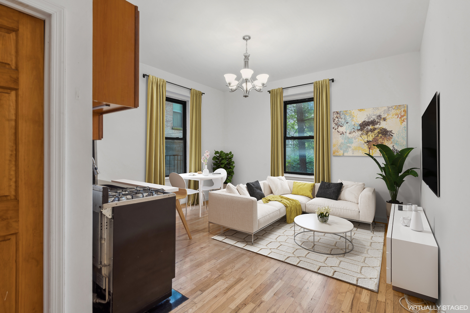 a living room with furniture and a chandelier