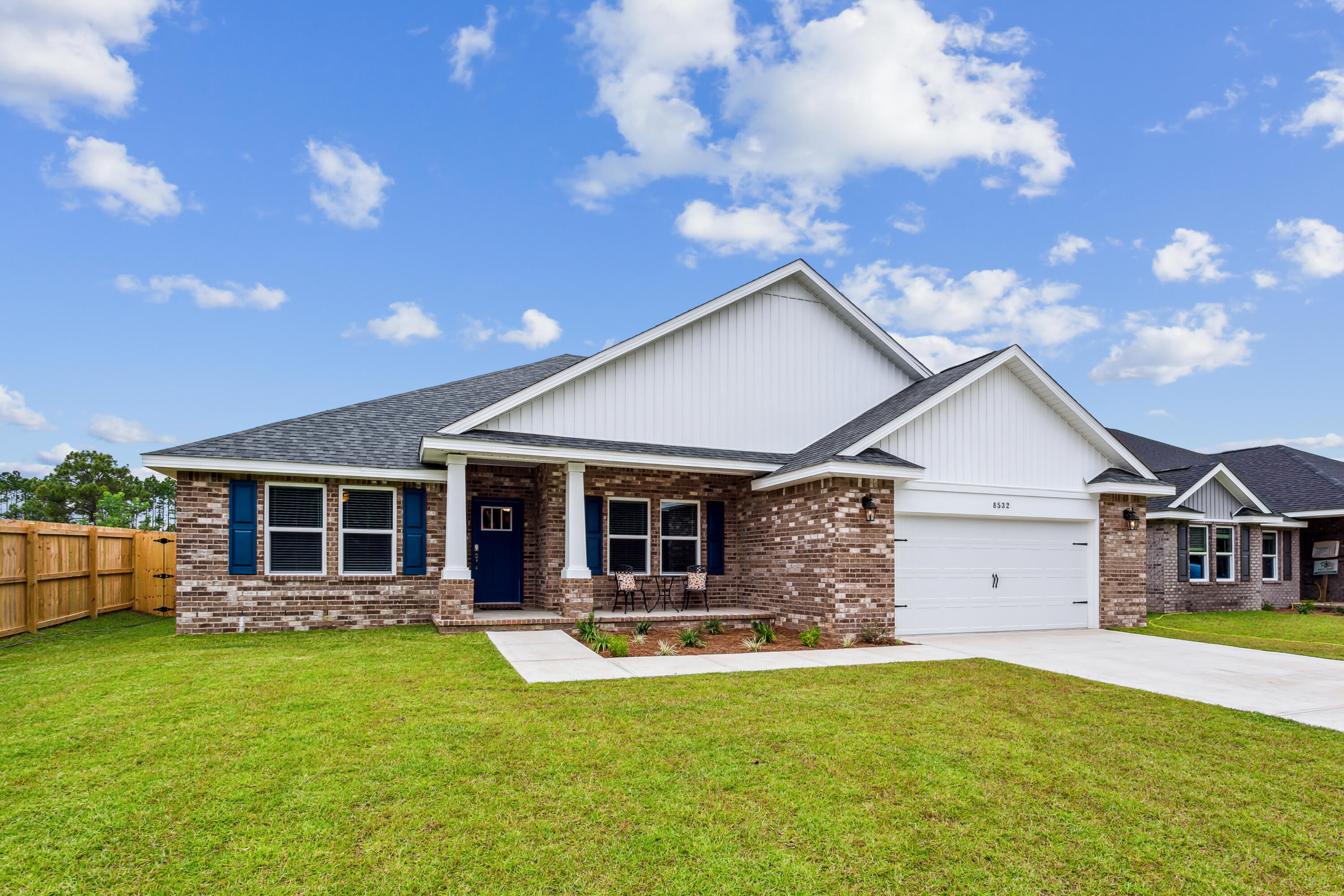 a front view of house with yard and green space