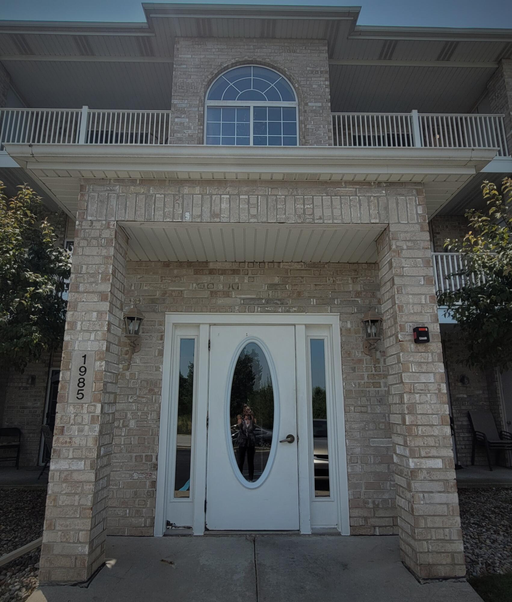 a front view of a house with a door