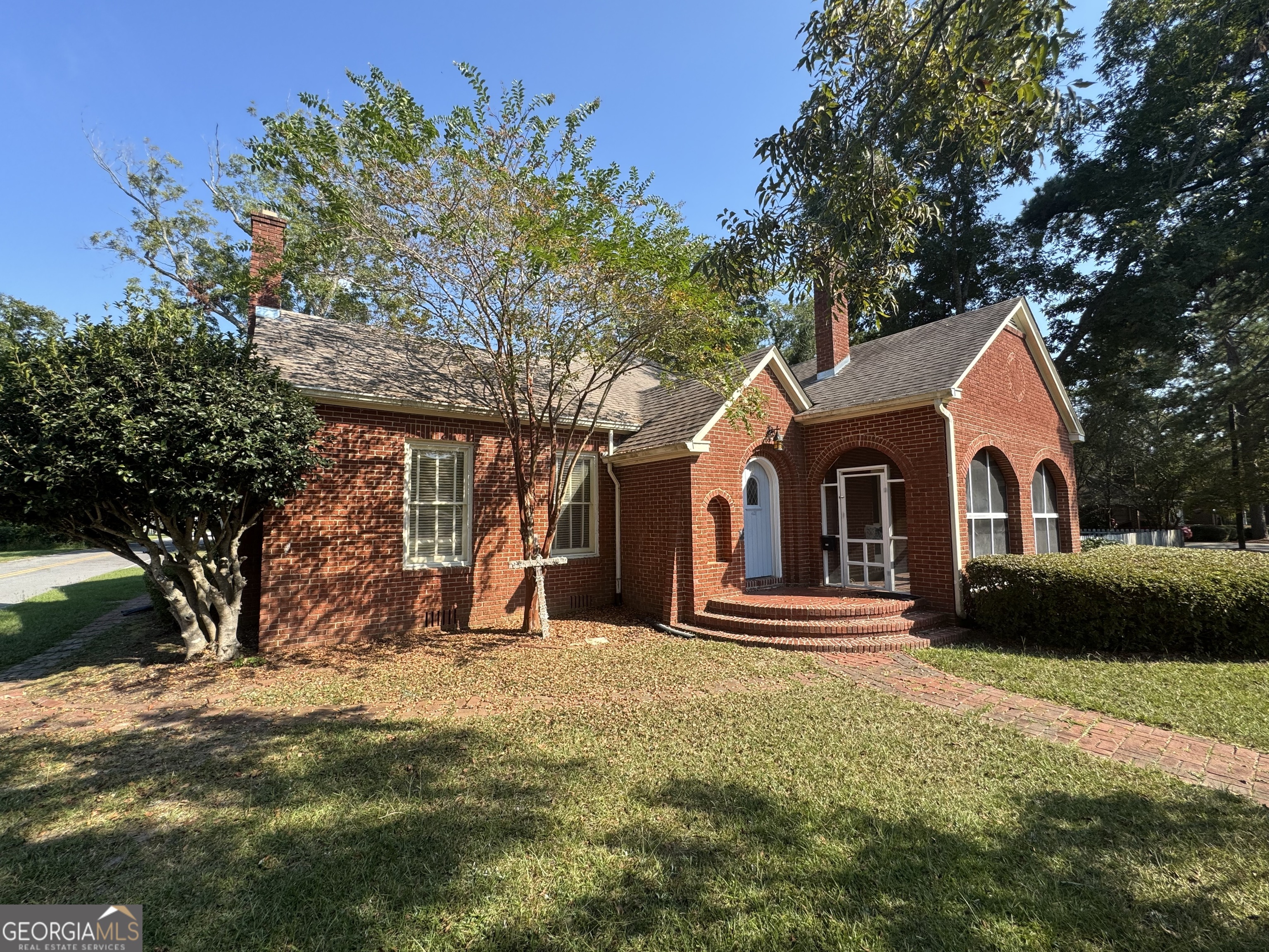 a front view of a house with a yard