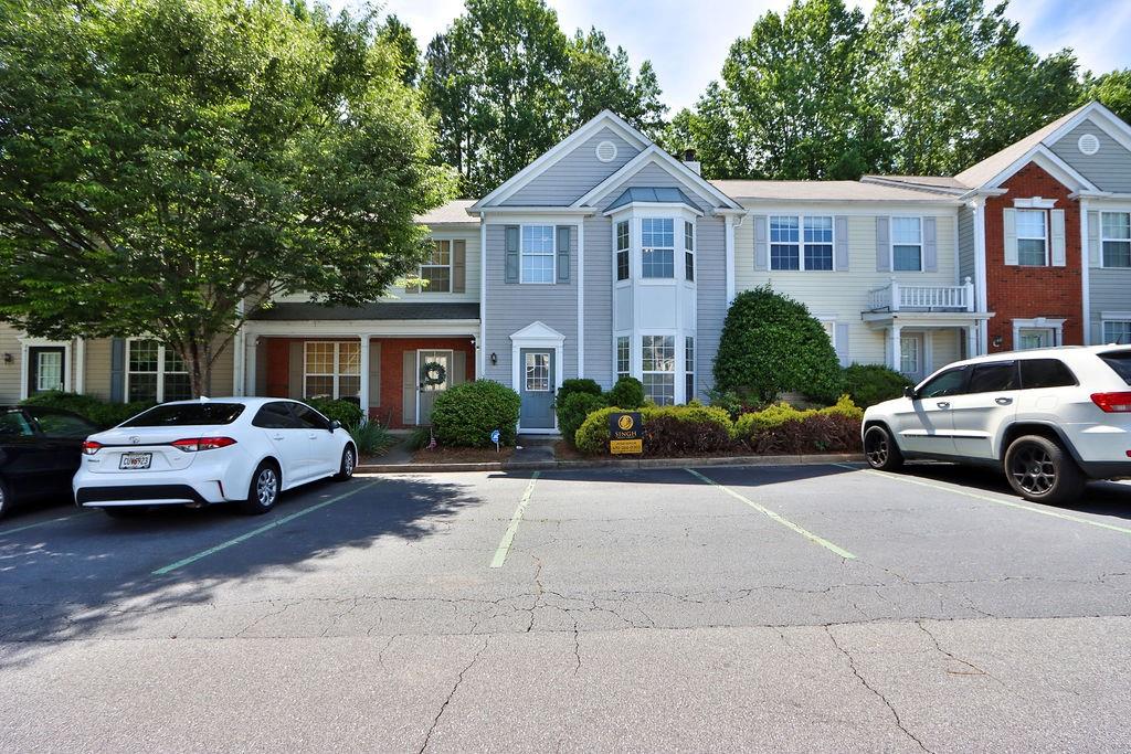 a view of a car parked in front of a house