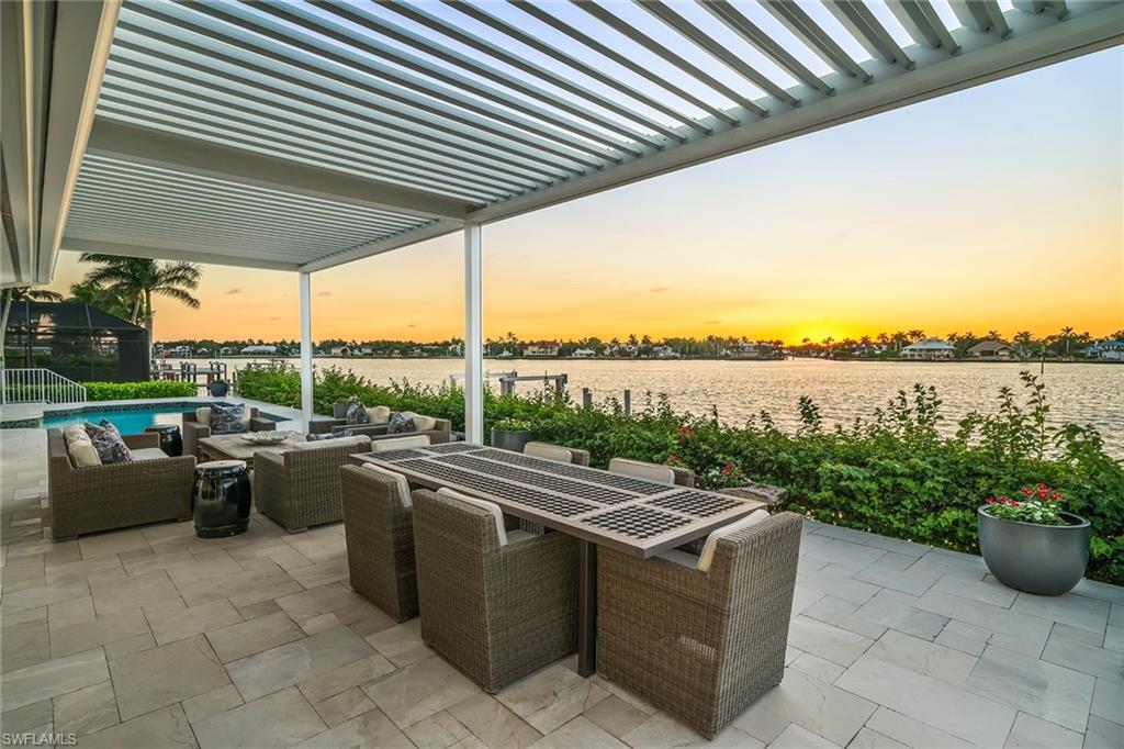 a view of a patio with couches and potted plants