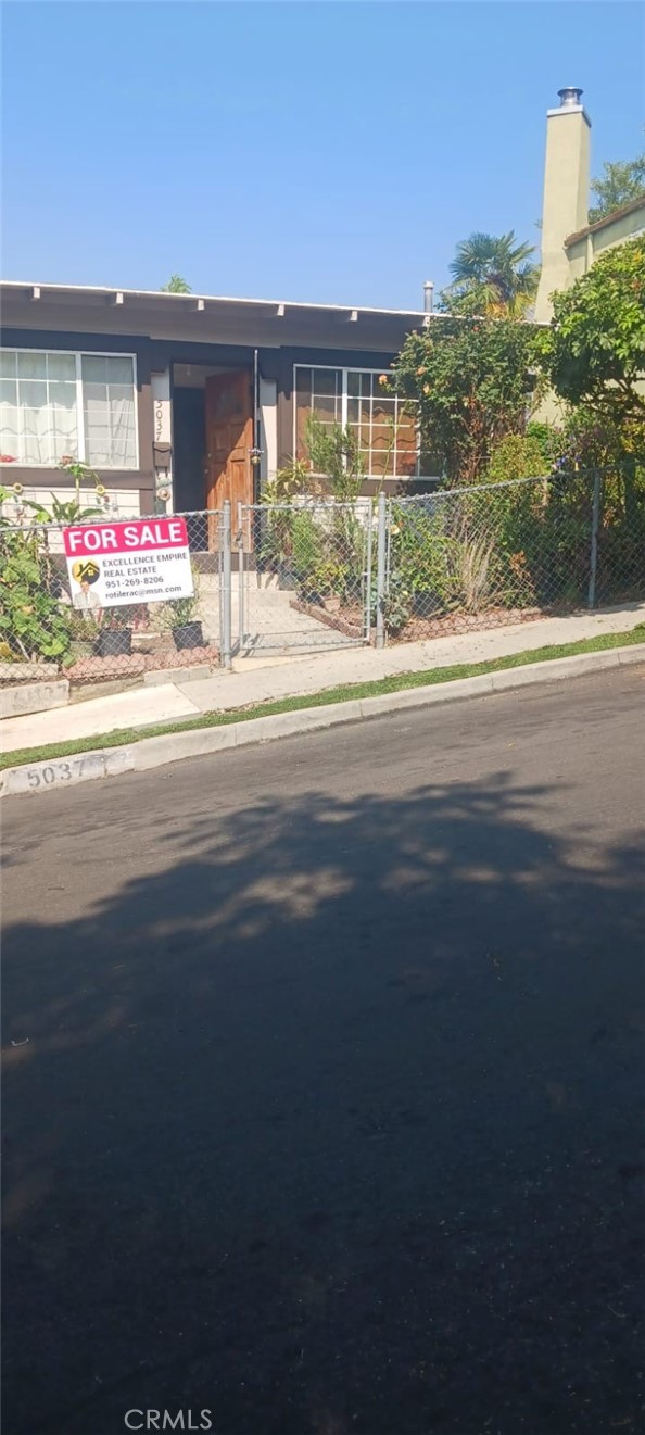 a front view of a building with street view