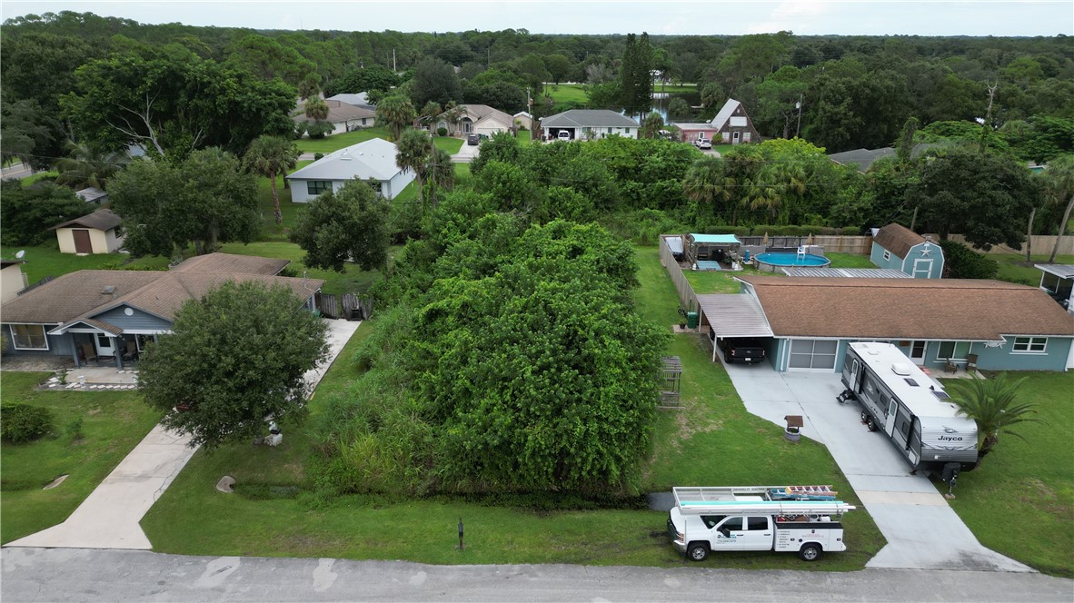 an aerial view of a car is parked on the side of the road