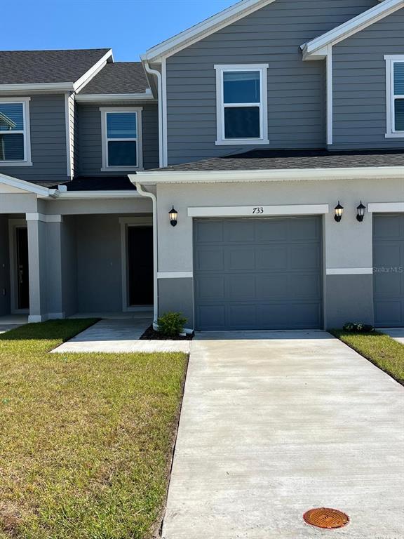 a front view of a house with a yard