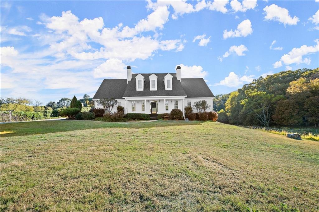 a front view of a house with a yard