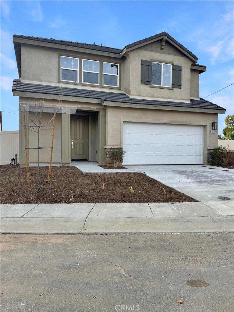 a front view of a house with garage