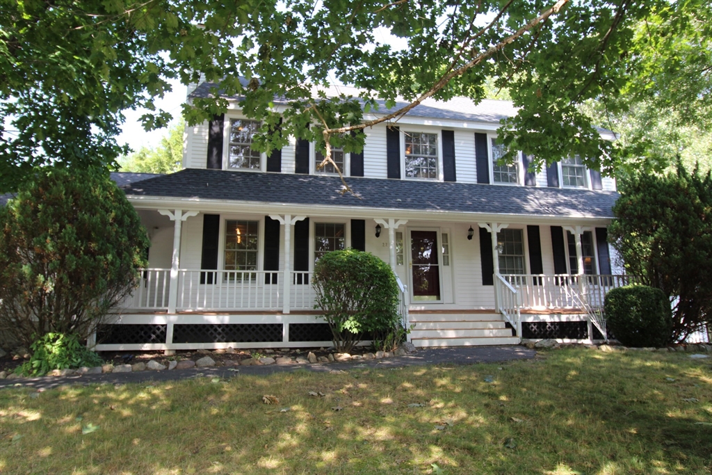 a front view of a house with yard