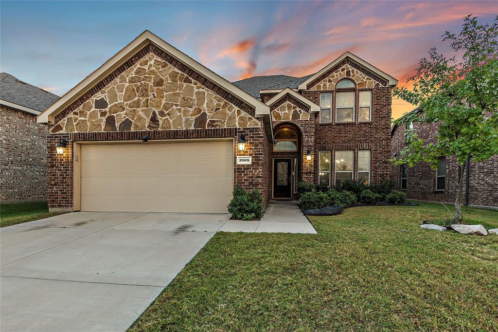 front view of a house with a yard