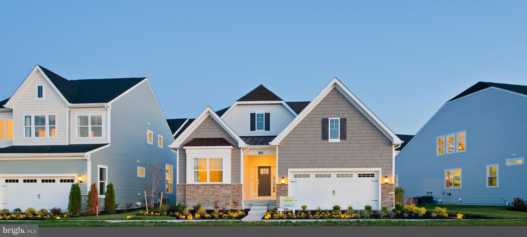 a front view of residential houses with yard