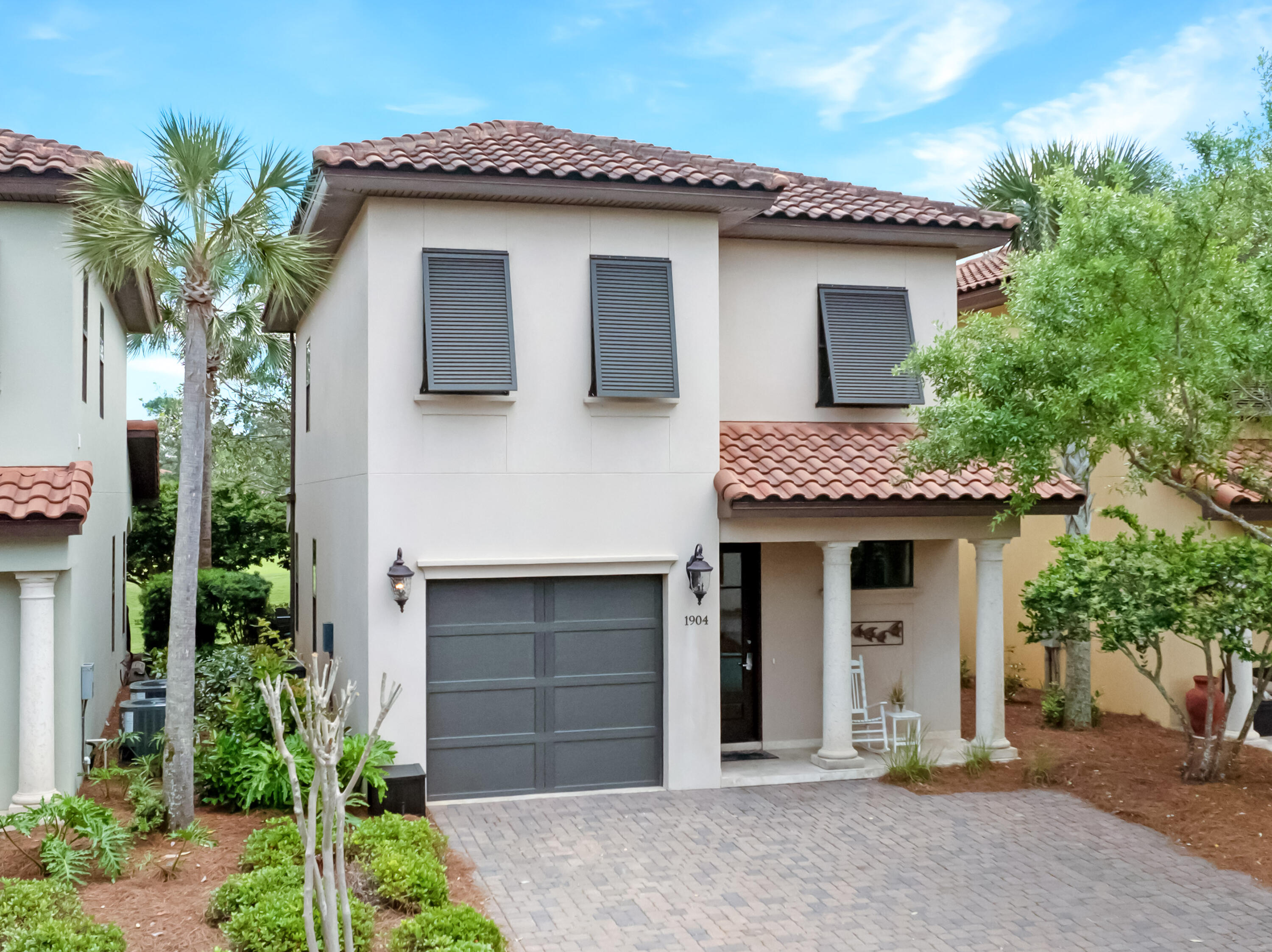 a front view of a house with a garage