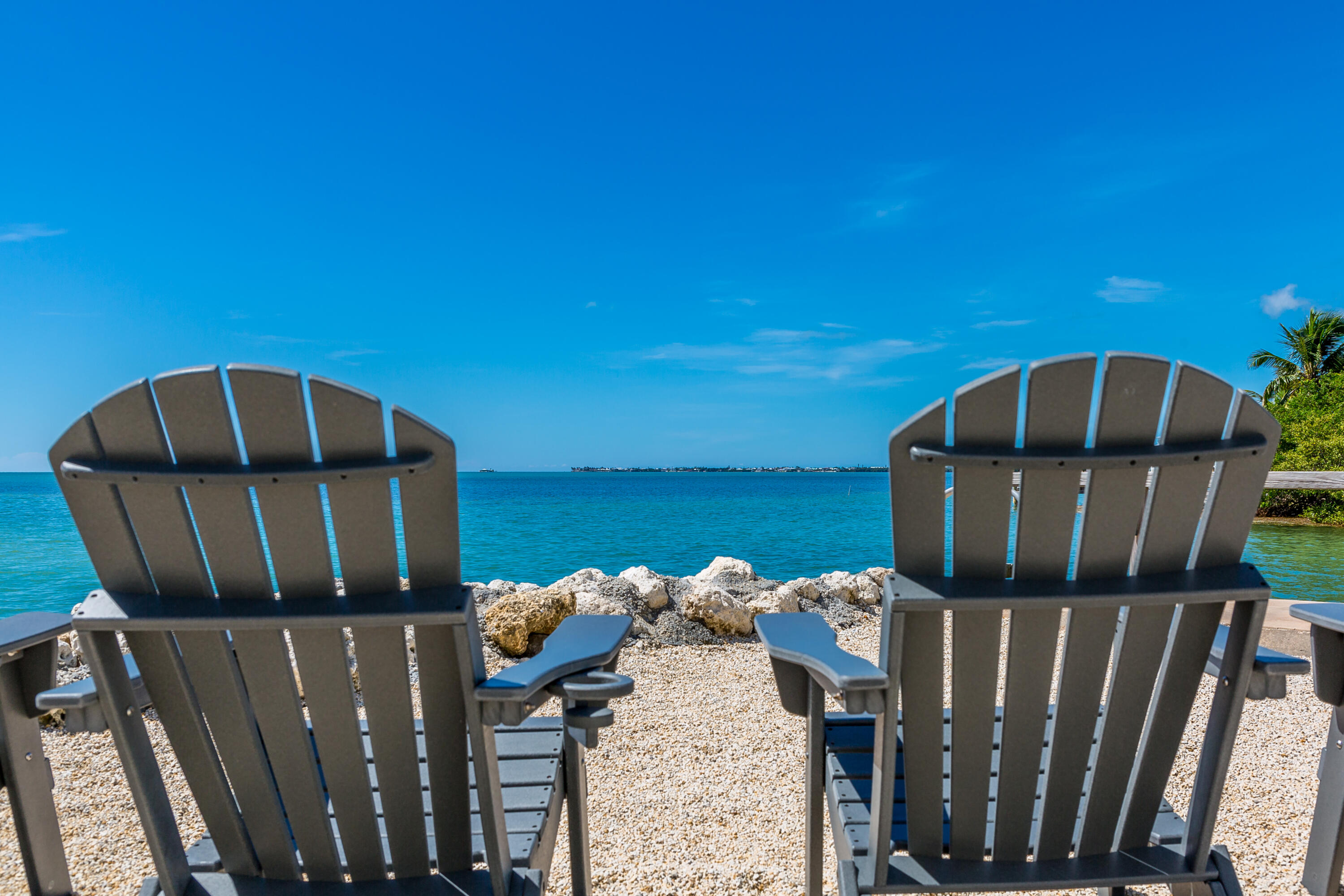 a view of a balcony with chairs