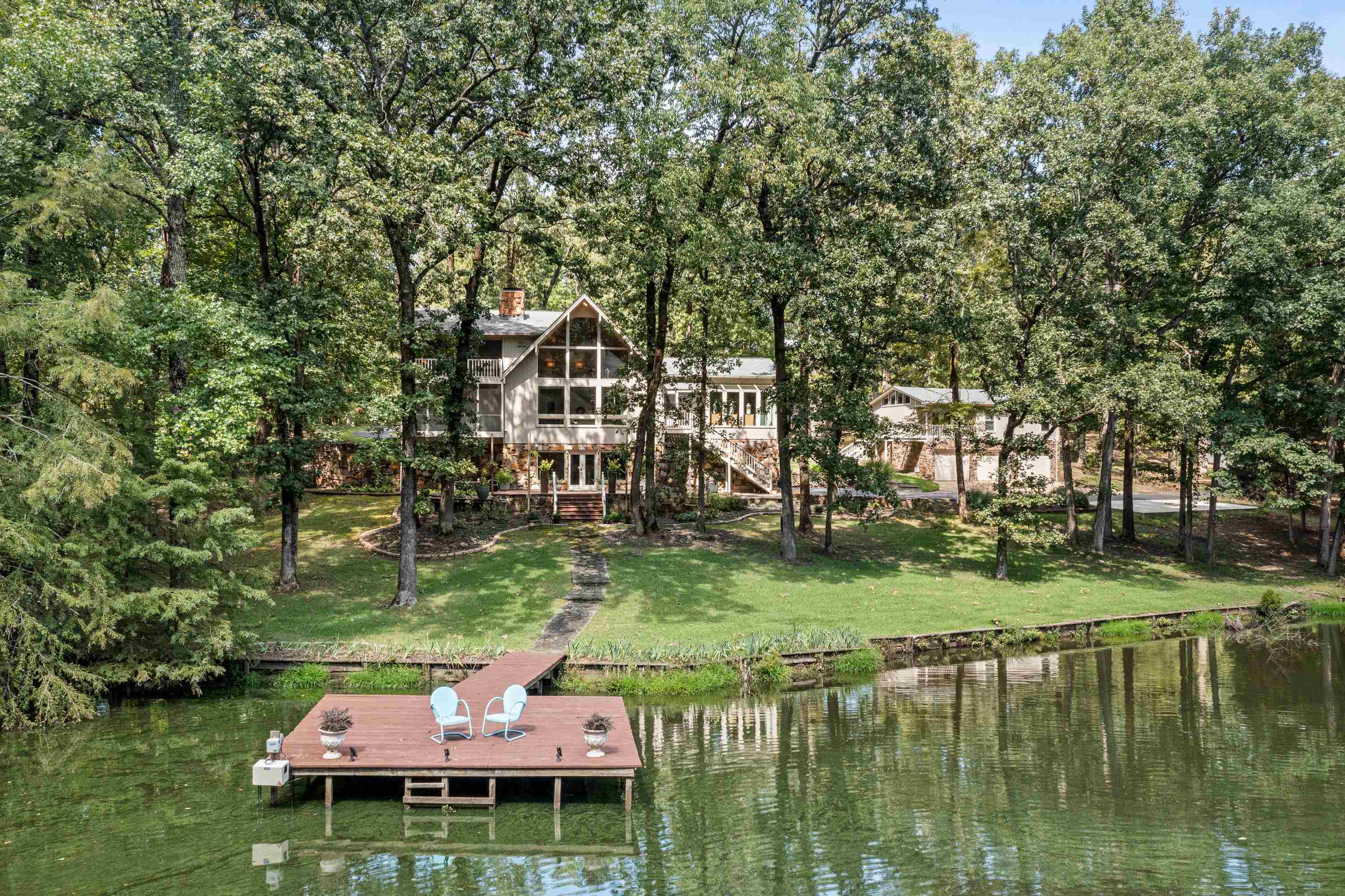 a backyard of a house with yard and lake view