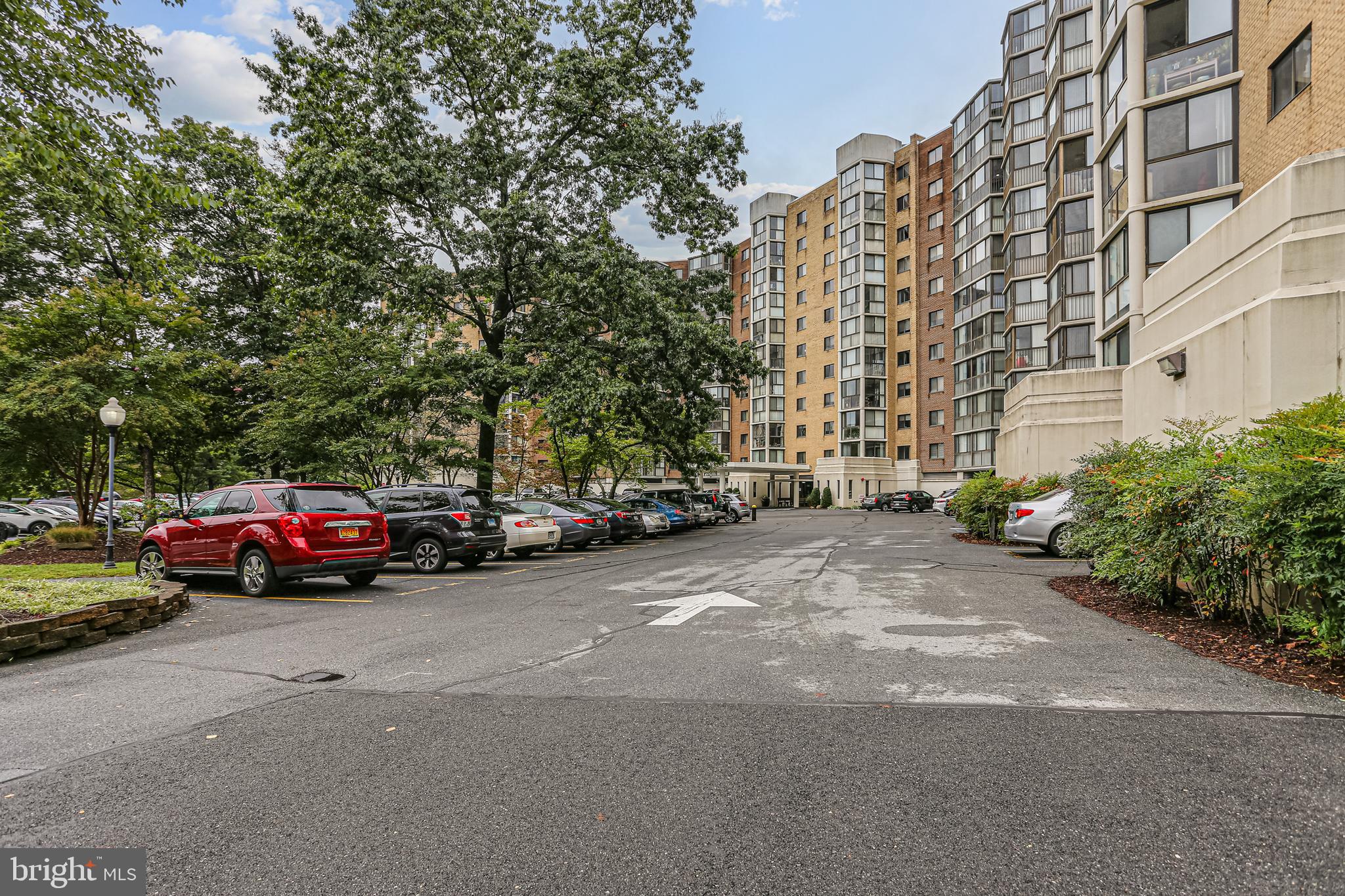 a view of street with parked cars