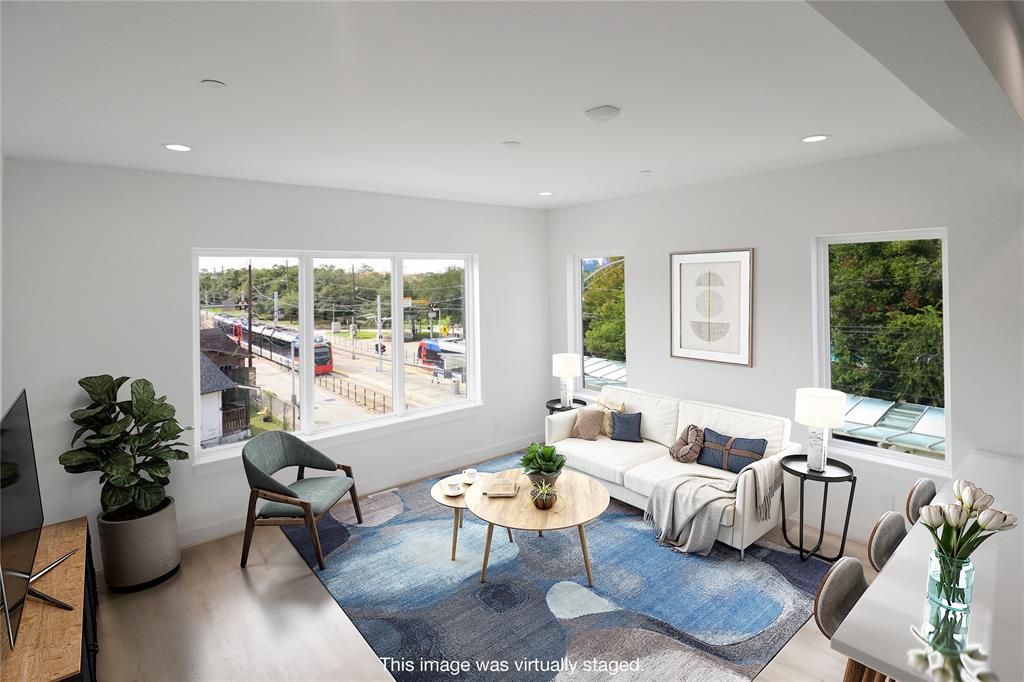 10' ceilings and large windows create a beautiful living space.  Downtown views from your coffee table!  This photo has been virtually staged.