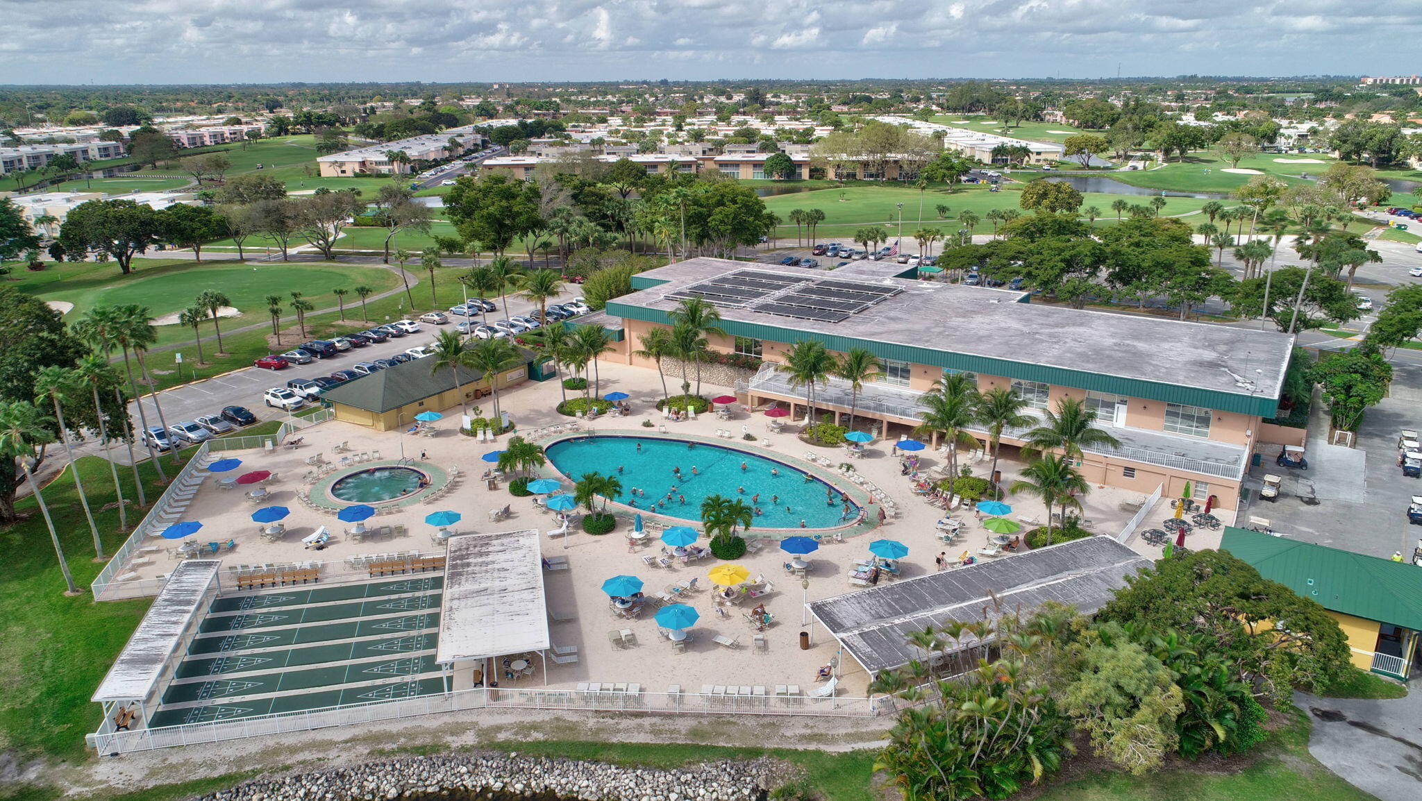 an aerial view of a and a yard with swimming pool