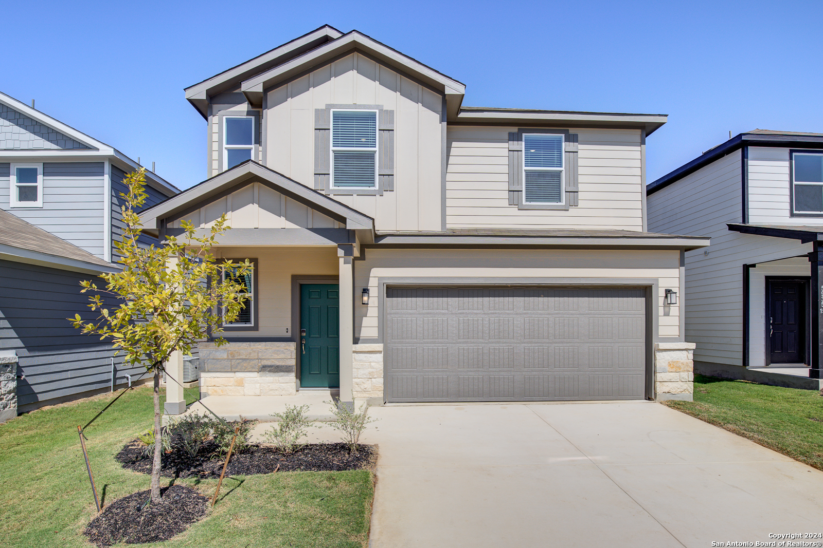 a front view of a house with a yard