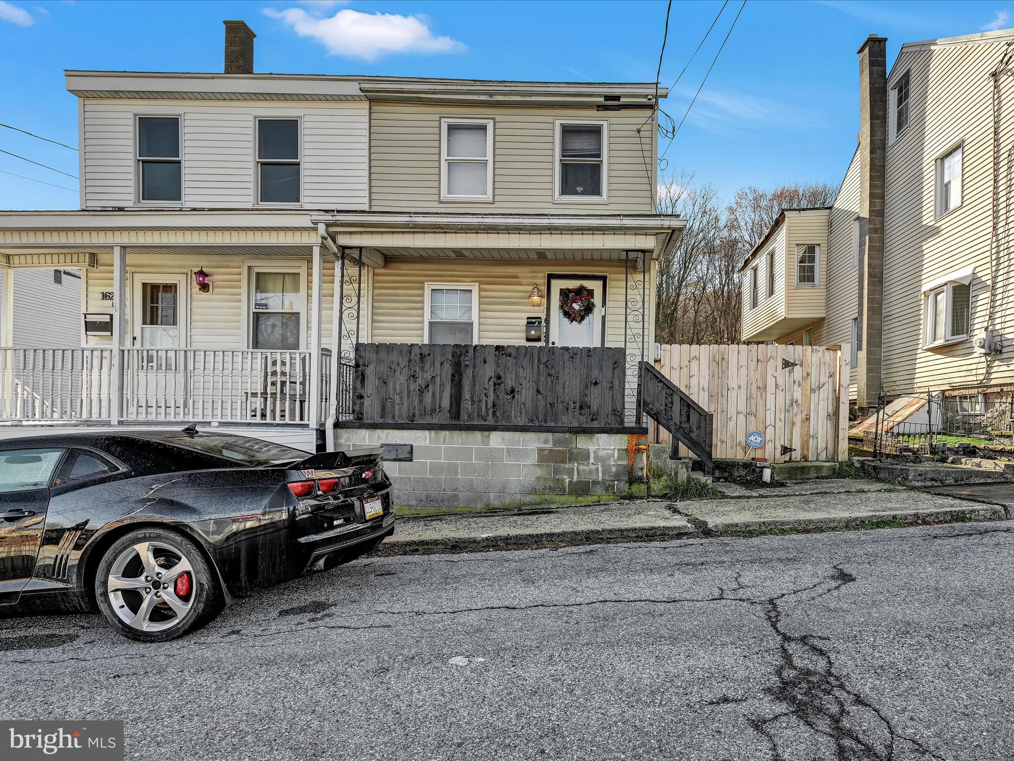 a car parked in front of a house