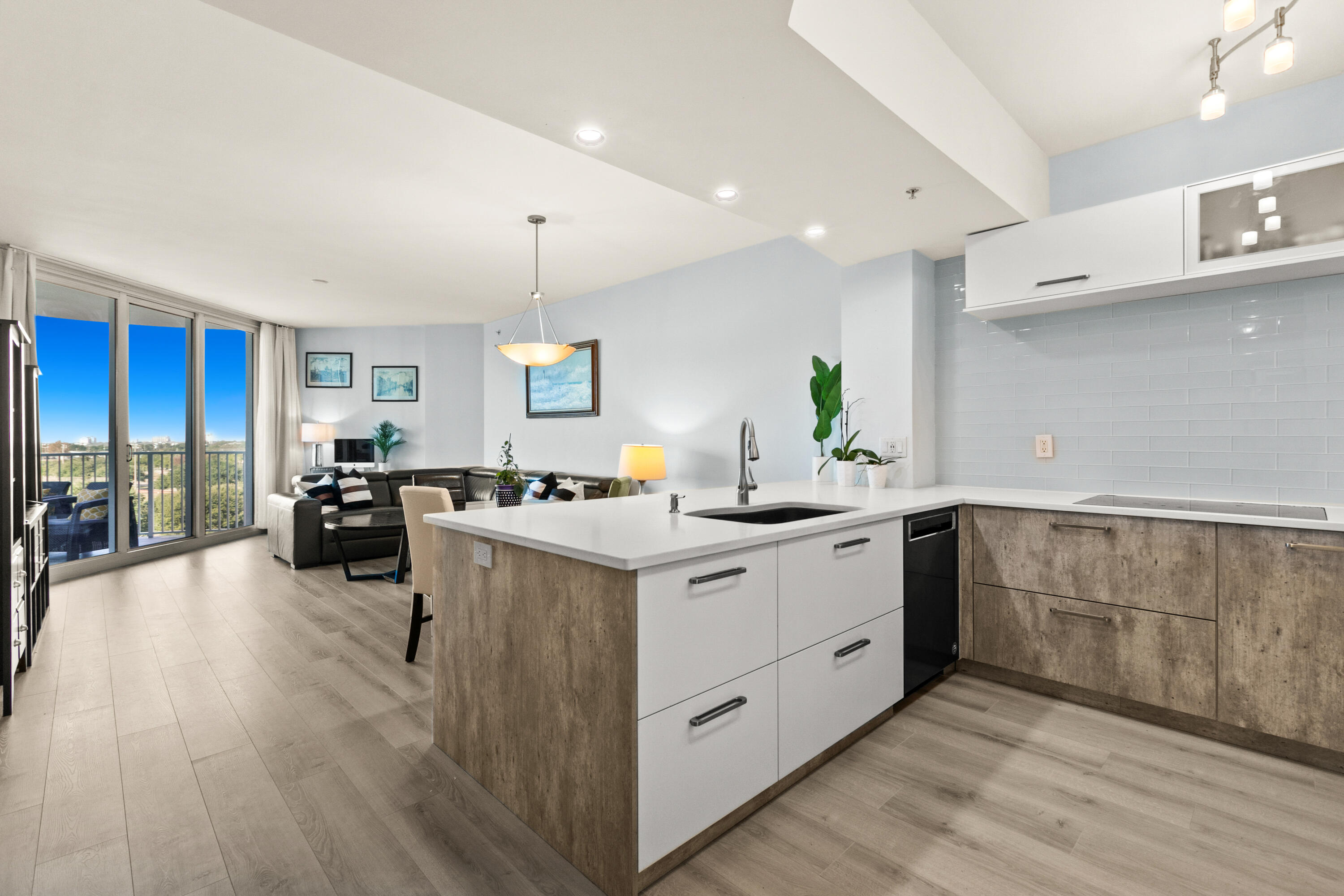 a kitchen with sink and cabinets