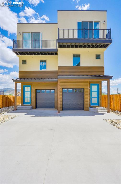 Contemporary house with a garage and a balcony