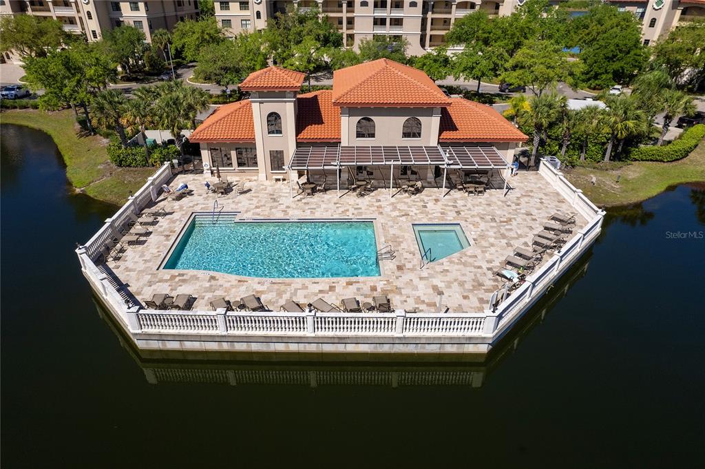 a view of a house with roof deck and sitting area