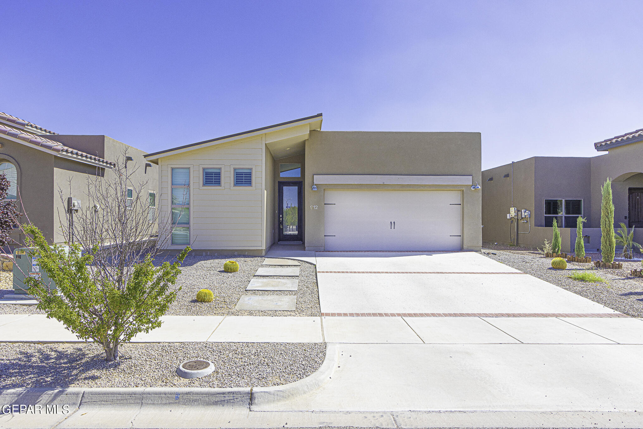 a front view of a house with a garage