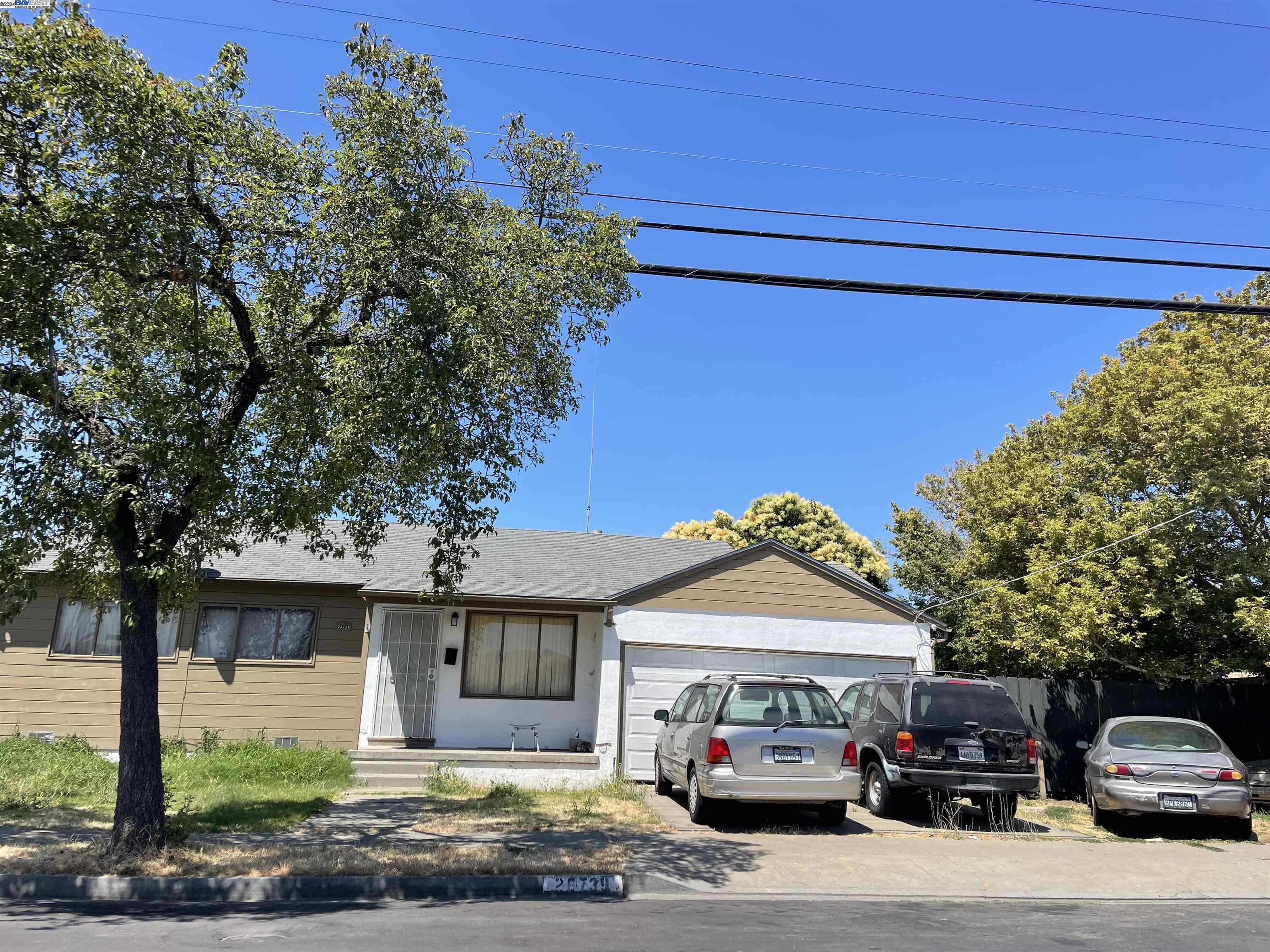 a car parked in front of a house