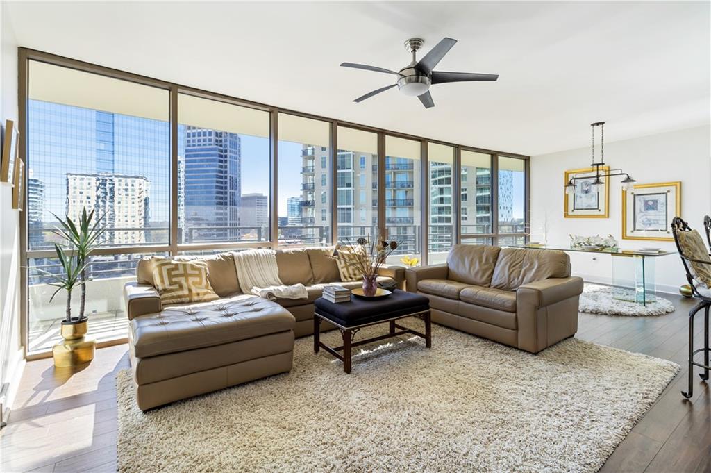 a living room with furniture and a large window