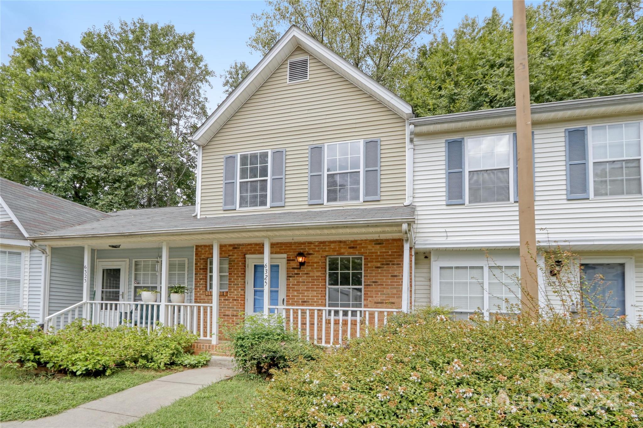 front view of a house with a yard