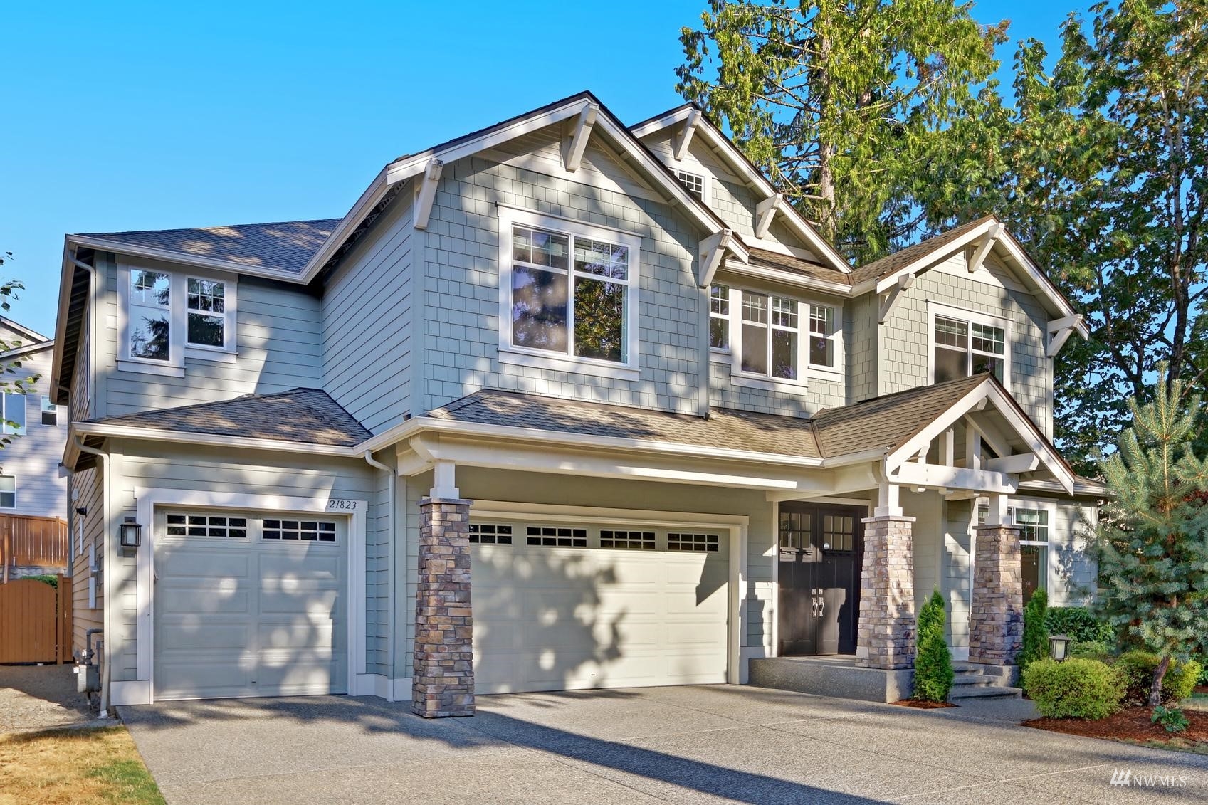 a front view of a house with a garage